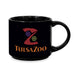 The Tulsa Zoo Logo Mug features a colorful abstract animal face with bold orange text—ideal for animal lovers and supporting wildlife education.