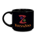The Tulsa Zoo Logo Mug is a black ceramic mug featuring a stylized animal head forming the letter Z above "Tulsa Zoo" in orange and gold—ideal for animal lovers and wildlife education fans.