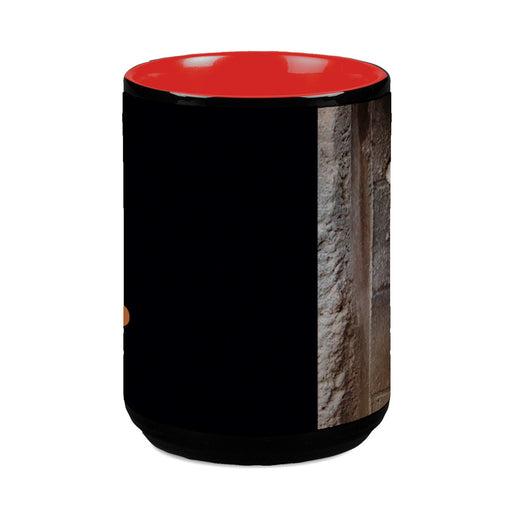 The Tulsa Zoo Portraits of Conversation Tiger Mug features a black exterior, bright red interior, and a partial stone wall image—perfect for supporting tiger conservation and wildlife education.