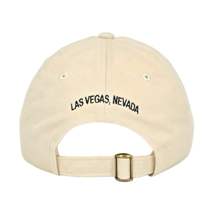 A beige cotton dad hat from The Mob Museum Two-Tone Dad Cap collection, viewed from the back and featuring “LAS VEGAS, NEVADA” embroidered in black above the adjustable strap and brass buckle, this classic accessory is a stylish tribute to the iconic museum.