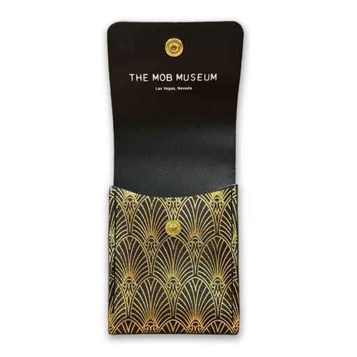 The Mob Museum Playing Card Holder—a black case adorned with gold art deco patterns—opens to reveal “THE MOB MUSEUM Las Vegas, Nevada” printed inside the flap, offering a stylish tribute to organized crime history.