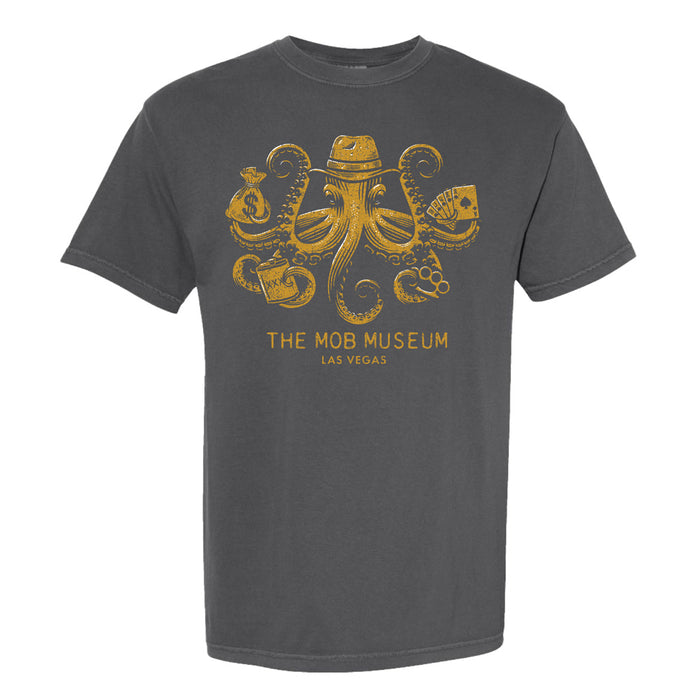 THe Mob Museum Mobster Octopus T-Shirt, showcasing a yellow octopus in a fedora holding a money bag, cards, a gun, and handcuffs, with “The Mob Museum Las Vegas” text below.