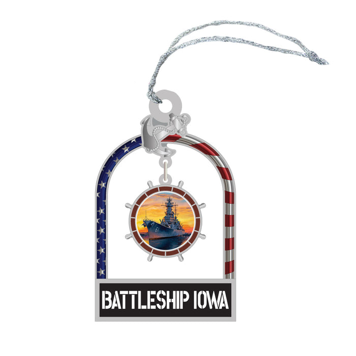 The Battleship IOWA Ornament showcases a striking image of the USS Iowa battleship at sunset, elegantly highlighted by an arched frame adorned with an American flag motif and anchor. Labeled “BATTLESHIP IOWA” at the base, this ornament is a fitting homage to America’s rich naval legacy.