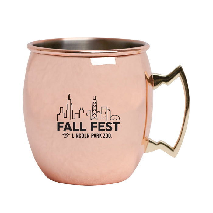The Lincoln Park Zoo Fall Fest Camper Mug is a copper-plated mug with a gold handle, featuring a black city skyline and the text “FALL FEST Lincoln Park Zoo”—the perfect souvenir from Lincoln Park Zoo’s Fall Fest.