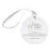 The Naples Botanical Garden John Eder Ornament is a round white porcelain ornament accented with a silver ribbon. It features the Naples Botanical Garden logo and text about the Frangipani flower, along with a photography credit to John Eder. This ornament beautifully captures the essence of Naples Botanical Garden.