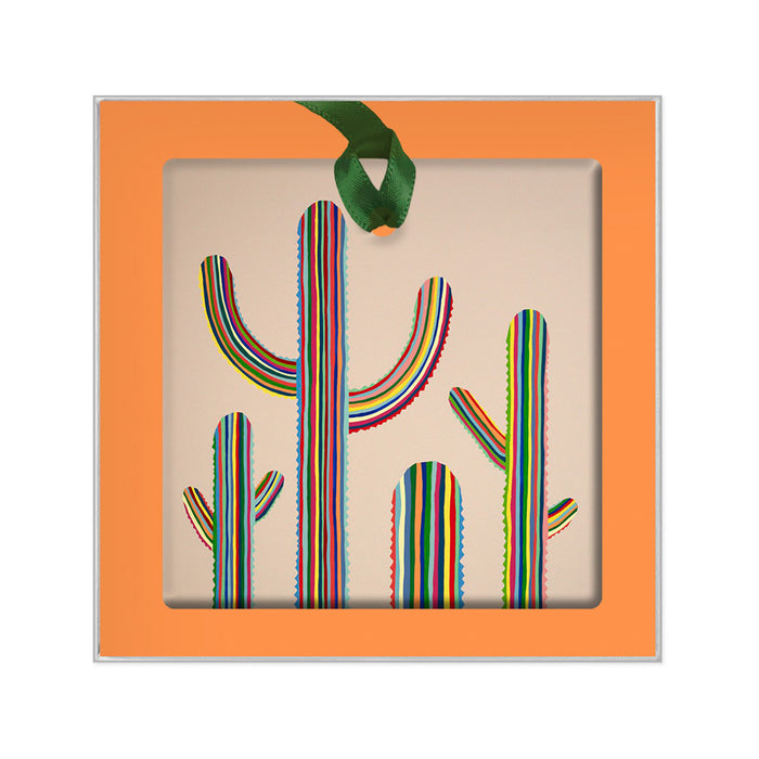 Desert Botanical Garden Will Beger Ornament: a square desert landscape keepsake with an orange border and a cutout of three vertically striped saguaro cacti, suspended by a green ribbon.