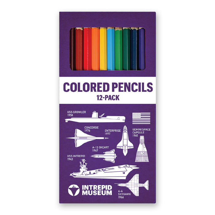 The Intrepid Museum Colored Pencils Pack is a purple box containing 12 colored pencils, decorated with white illustrations of ships, aircraft, and a space capsule, along with references to the Intrepid Museum and its exhibits—an ideal gift for aviation history enthusiasts.