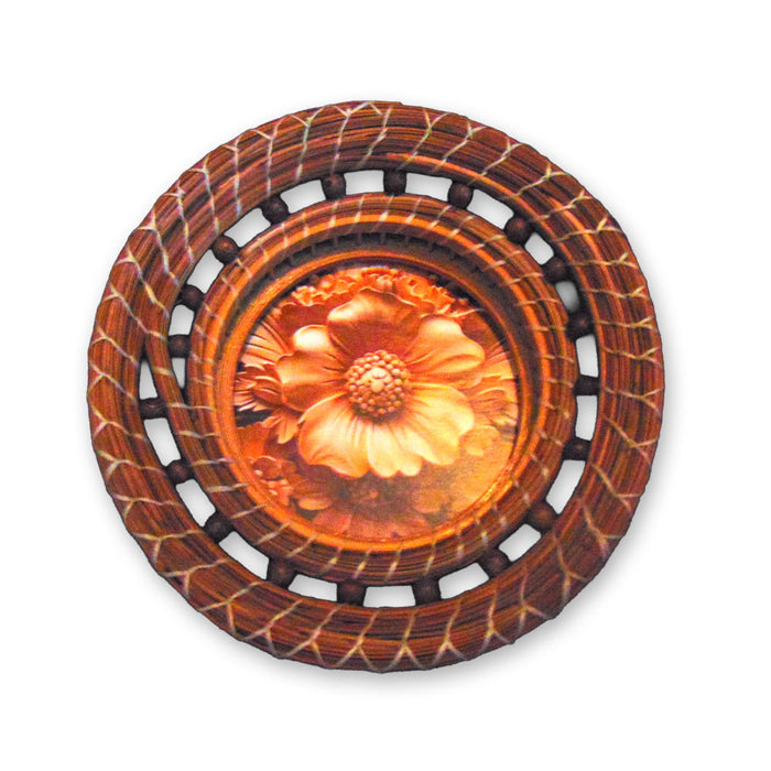 The Pine Needle Flower Basket is a round decorative wall hanging featuring a carved flower design at its center, encircled by a woven, circular wooden frame. With rich shades of brown and orange, it brings a perfect rustic touch to your home decor.