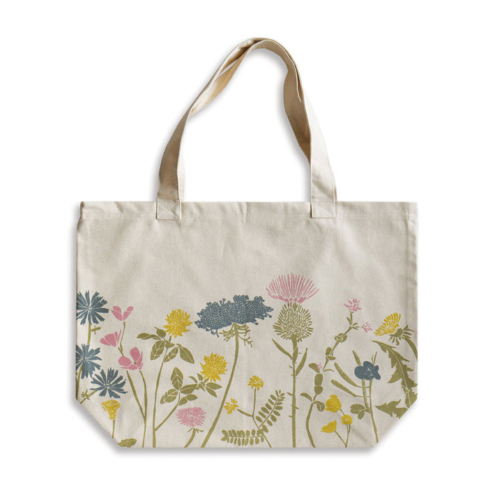 Off-white Wildflower Organic Tote featuring a print of wildflowers in shades of pink, yellow, and blue.