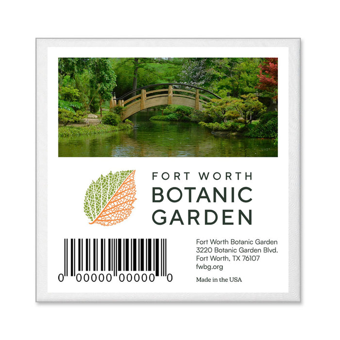 Square Fort Worth Botanical Garden Ornament featuring a photo of a curved wooden bridge over a pond, an orange leaf graphic, the garden’s address and website, and a barcode.