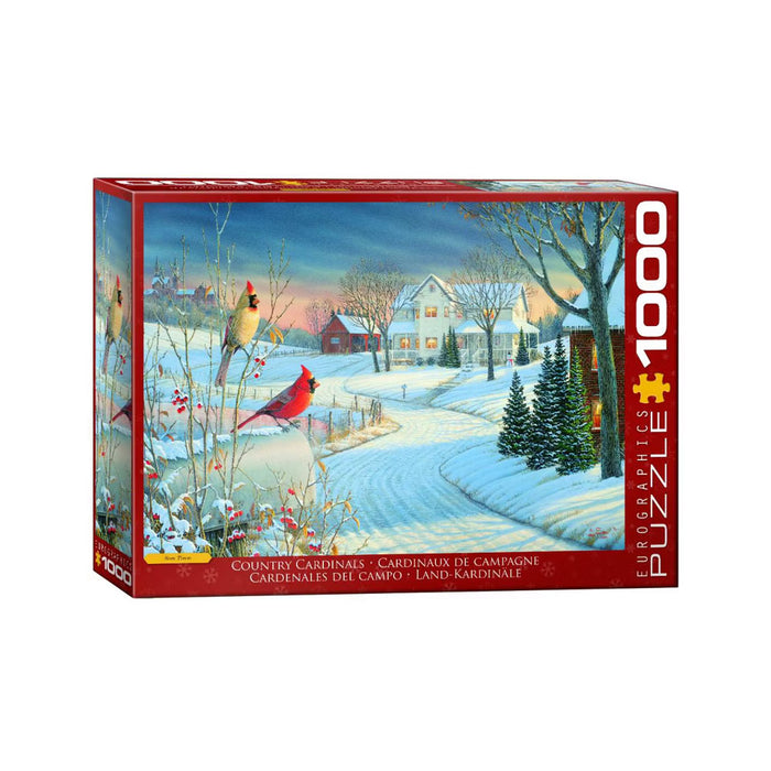 Country Cardinals 1000 Piece Puzzle box featuring a snowy winter scene with a farmhouse and two red cardinals in the foreground.