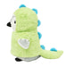 A 12" plush penguin wears the eco-friendly Plushy's Closet Dino Costume—fuzzy light green with blue spikes—facing left on a white background.