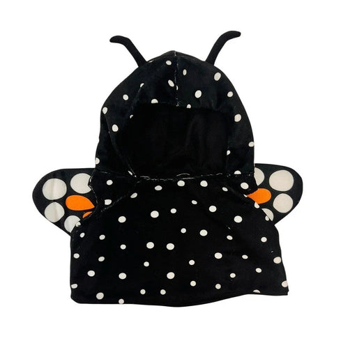 The Plushy's Closet Butterfly Costume is a black hooded outfit for kids with white polka dots, two antennae on the hood, and butterfly wings featuring white and orange spots attached to the back.