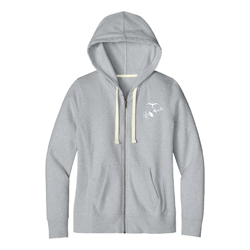 The United States Marine Corps Globe Insignia Zip Sweatshirt in light gray features a hood, cream-colored drawstrings, two front pockets, and a small white USMC Globe Insignia on the left chest. The sweatshirt is shown laid flat against a white background.