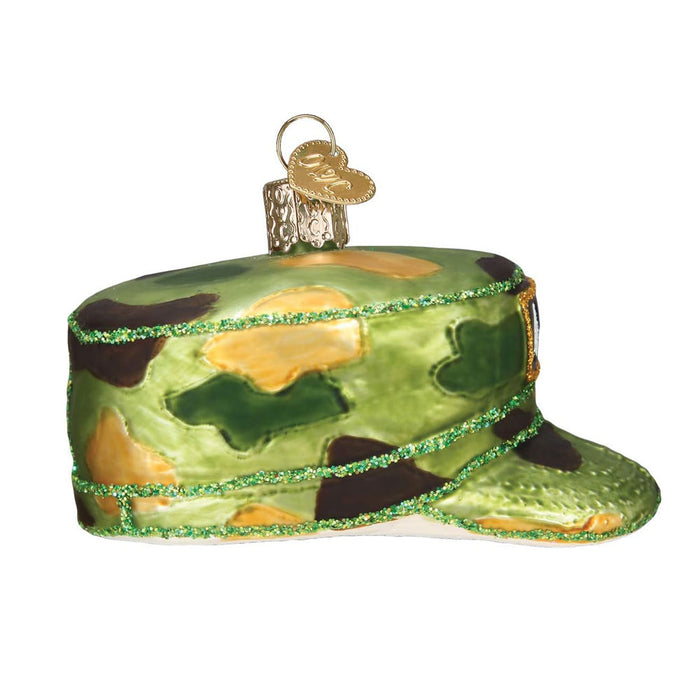 The Army Cap Ornament by Kurt Adler features a camouflage military cap design with green glitter trim and a gold hanging loop—ideal for any U.S. Army ornament collection.
