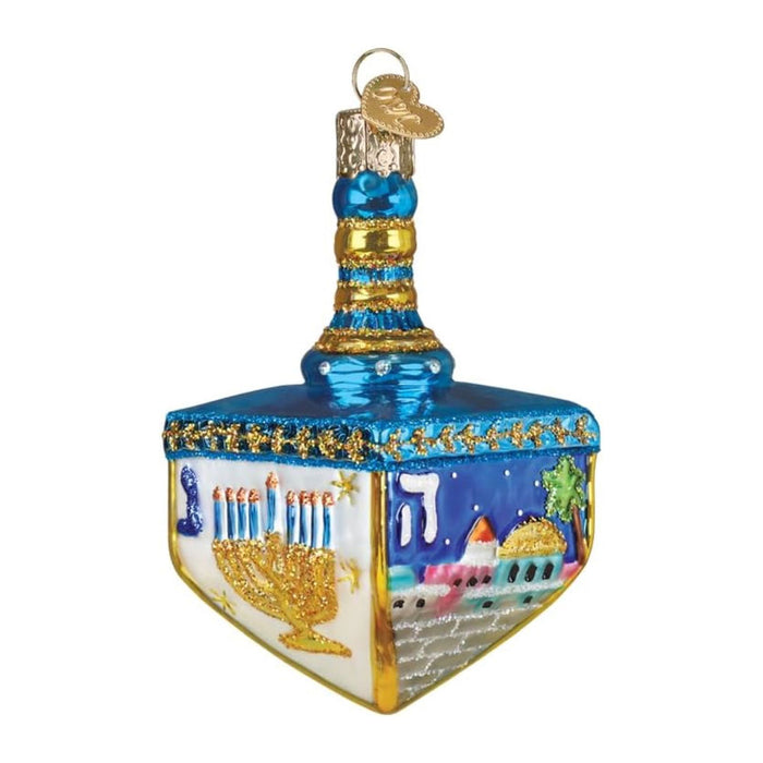 Hanukkah Dreidel Ornament, a hand-painted glass dreidel featuring a menorah, the Hebrew letter he, and a cityscape with a golden dome.