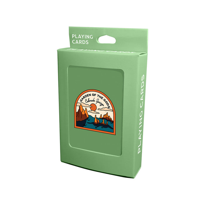 A green box of Garden of the Gods Playing Cards featuring an illustrated patch that reads “Garden of the Gods, Colorado,” and depicts striking red rock formations beneath a blue sky—a perfect Colorado souvenir capturing this iconic landscape.