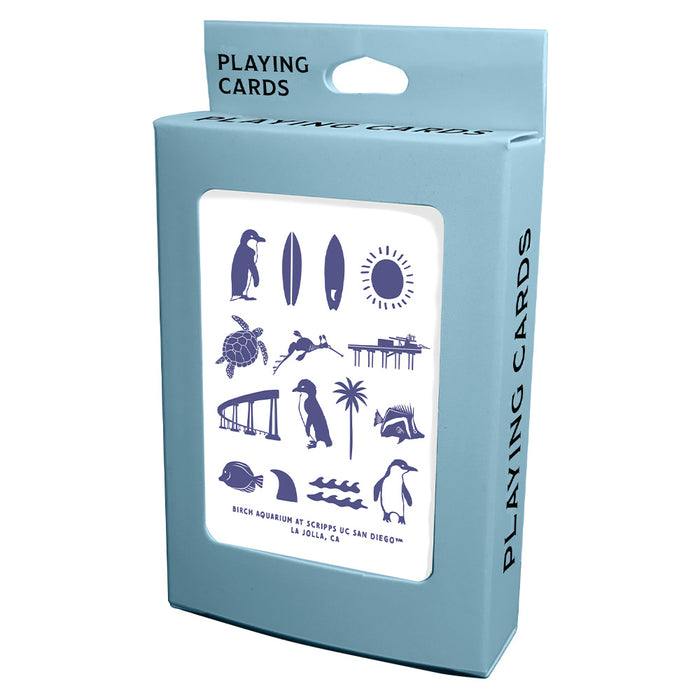 A deck of playing cards in a light blue box decorated with blue illustrations of sea life and beach icons, labeled Birch Aquarium at Scripps UC San Diego.