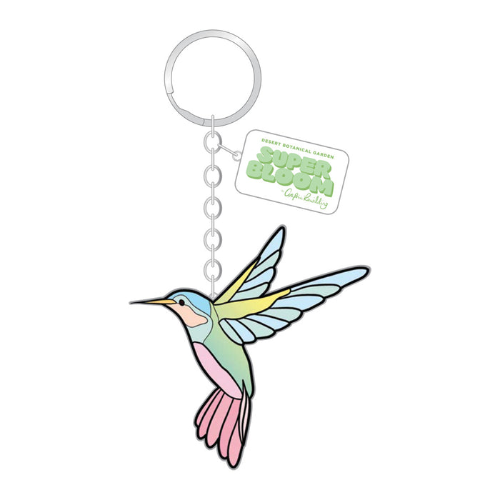 Desert Botanical Garden Hummingbird Superbloom Keychain featuring a hummingbird-shaped charm with a rectangular tag displaying a graphic.