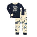 Wide Awake Shark Toddler Pajama Set featuring a navy long-sleeve shirt with a shark graphic and Wide Awake text, paired with cream-colored pants patterned with various sharks.