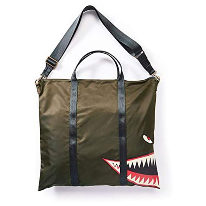 Introducing the P40 Aviation Helmet Bag: a square olive-green tote featuring black straps, a detachable shoulder strap, and a printed cartoon shark mouth and eye in one corner—perfect for those who appreciate unique aviation gear bags inspired by the classic P40.