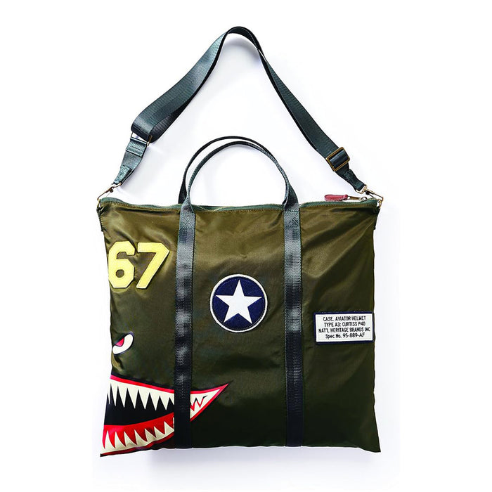 The P40 Aviation Helmet Bag features an olive green design with black straps, distinctive military patches—including a star emblem, the number 67, and a bold shark mouth graphic—and is finished with a white label patch on the front, drawing inspiration from classic aviation gear for a striking and functional accessory.