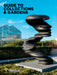 A twisting black sculpture of abstract human faces stands in front of a modern glass conservatory at Frederik Meijer Gardens & Sculpture Park under a blue sky, greeting visitors with a striking introduction to the renowned sculpture park—just one of many highlights featured in the Guide to Collections & Gardens.