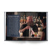 A bearded bartender smiles as he expertly shakes a cocktail shaker behind the bar, surrounded by bottles in the background. On the bar sits a garnished drink, while a woman engages with him across the counter. A text box on the left page highlights unique bartender stories and signature recipes featured in *Chicago Cocktails: An Elegant Collection of Over 100 Recipes Inspired by the Windy City (City Cocktails)*.