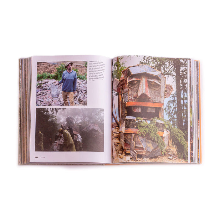 An open book of Trash, Trolls and Treasure Hunts displays a recycle artist’s work: a man standing by a wooden sculpture, a team building in a foggy forest, and a close-up of a giant troll sculpture nestled among trees.