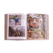An open book of Trash, Trolls and Treasure Hunts displays a recycle artist’s work: a man standing by a wooden sculpture, a team building in a foggy forest, and a close-up of a giant troll sculpture nestled among trees.