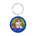 The Betsy Ross House Layered Keychain is a round accessory showcasing an illustration of the iconic landmark, bordered by white stars against a blue background and finished with the “Betsy Ross House” text at the bottom. This patriotic keychain makes a perfect way to celebrate America’s heritage and history.