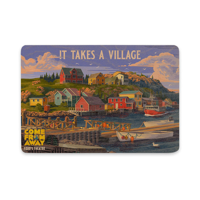 A colorful Ford’s Theatre Come from Away It Takes a Village Post Card illustrating a coastal village with houses on a hill above a harbor, featuring the text IT TAKES A VILLAGE at the top and the musical’s logo at the bottom left.