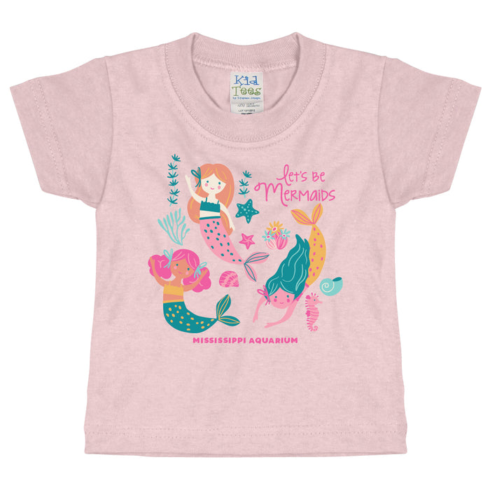 The Mississippi Aquarium Be Mermaids Toddler T-Shirt features a charming design with three colorful mermaids, lively sea plants, and a friendly seahorse. The shirt showcases the phrases “lets be Mermaids” and “MISSISSIPPI AQUARIUM,” while each mermaid displays a unique hair color and happy expression—making it an ideal pick for young ocean enthusiasts.