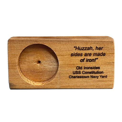 This wooden Coin Holder is is made with authentic wood reclaimed from the decks of the USS Constitution ship during refurbishment. This Wooden holder comes without a medallion, which is sold separately.