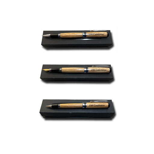 Three Americana Pens and Pencils, each engraved with USS Constitution on the barrel, are displayed in a black case. Shown uncapped (top, middle) and capped (bottom), these classic writing instruments highlight their elegant design.