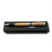 The Americana Pens and Pencils, featuring wood and metal in classic USS Constitution style, are displayed on a black gift box set against a white background.
