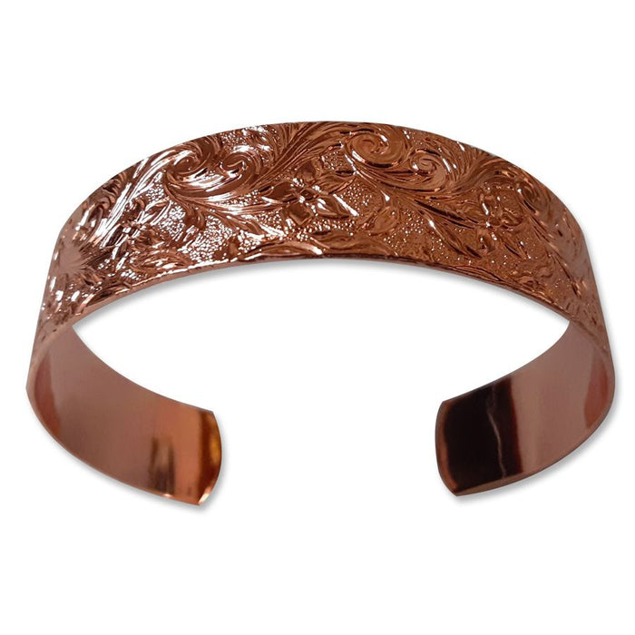 The USSCM Reclaimed Copper Bracelet is hand-crafted in the USA with an engraved floral and vine pattern, open back, and a polished finish.